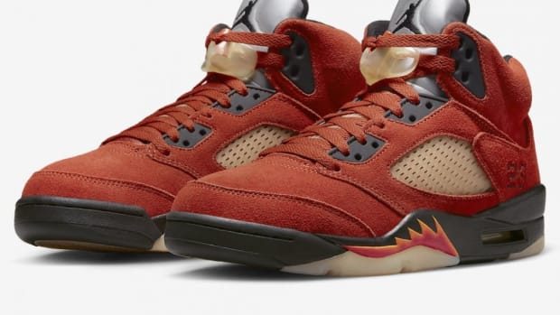 View of red and black Air Jordan shoes.